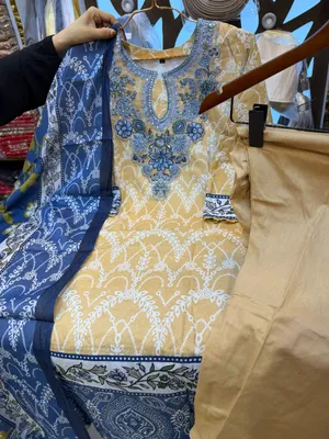Exclusive Swizz Lawn Stitched Three-Piece Collection with Embroidered Organza Neck Panel (Mustard Yellow & Royal Blue)