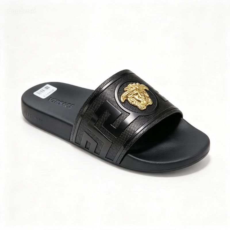 luxury-style embossed slide: Greek-key pattern strap 3D medallion accent, cushioned footbed-black-gold, silver