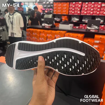black and white Nike Downshifter 12 running shoes
