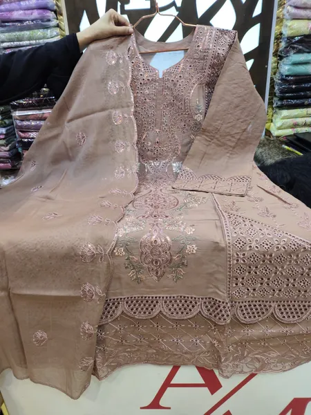 Sophisticated Swizz Lawn Suit with Intricate Boring Work