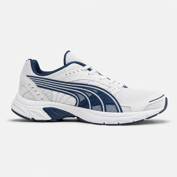 Puma Axis sneakers in a white and navy colorway